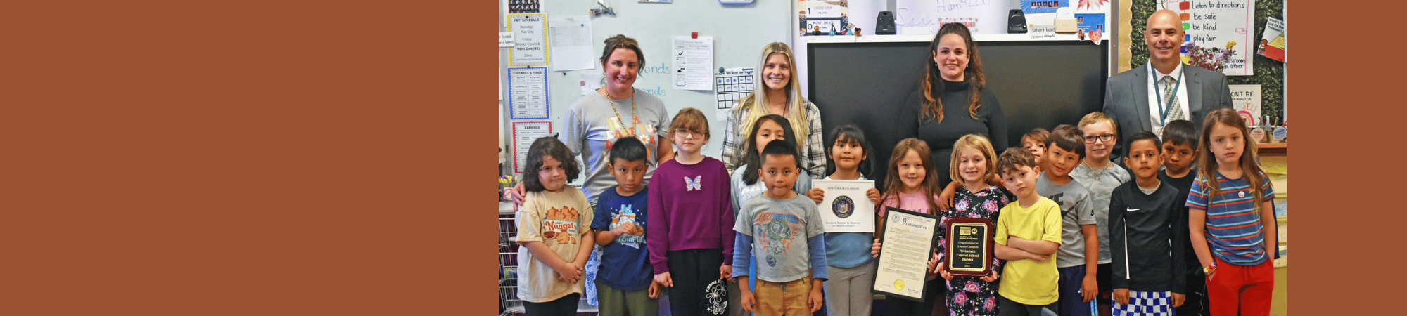 Children in Webutuck School with Superintendent and teachers