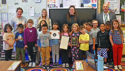 Children in Webutuck School with Superintendent and teachers